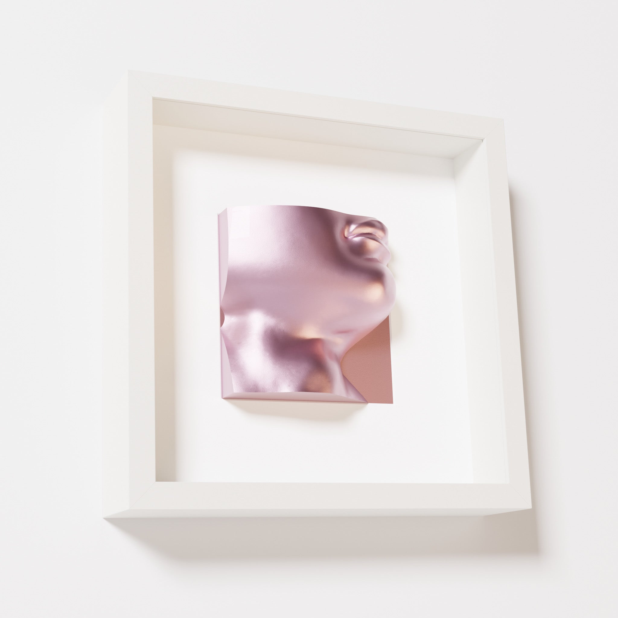 A close-up of a white shadowbox frame containing a metallic rose sculpture of 'David's Lip,' highlighting the detailed lips, chin, and reflective pink finish inspired by Michelangelo's David.