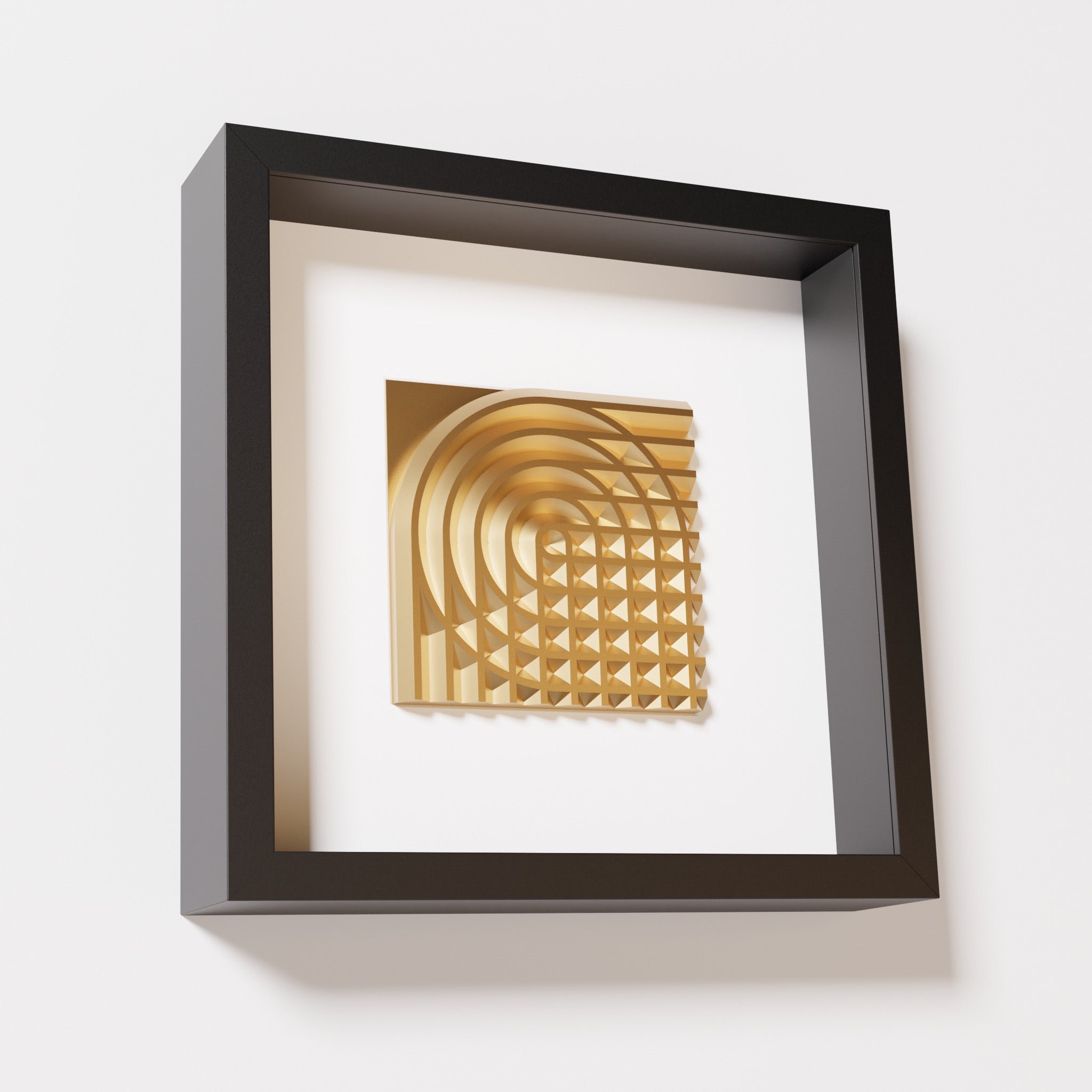 A close-up of a black shadowbox frame containing a chrome gold artwork featuring the elegant arcs and geometric grid of 'Rainbow II,' showcasing reflective golden highlights.