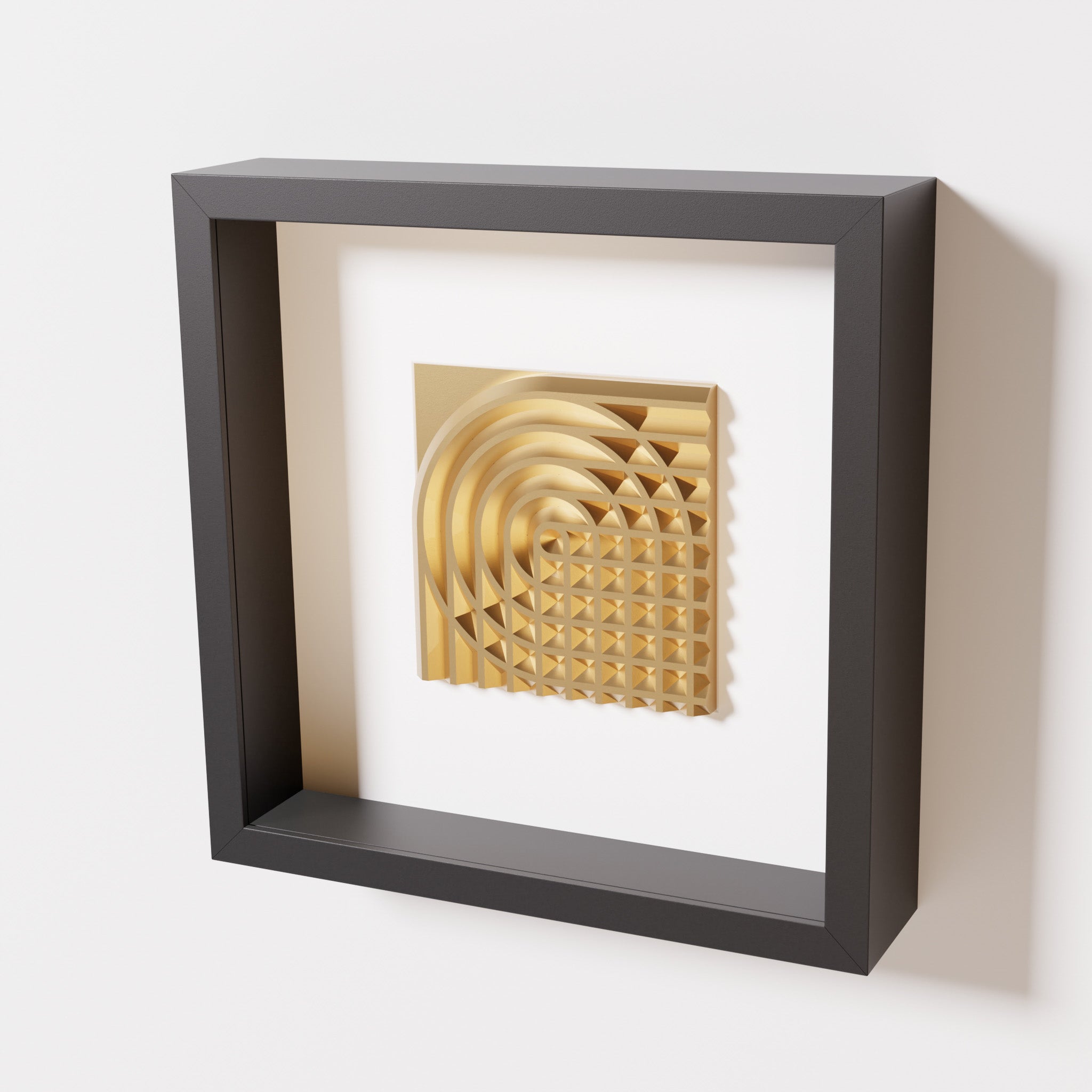 A close-up of a black shadowbox frame containing a chrome gold artwork featuring the elegant arcs and geometric grid of 'Rainbow II,' showcasing reflective golden highlights.