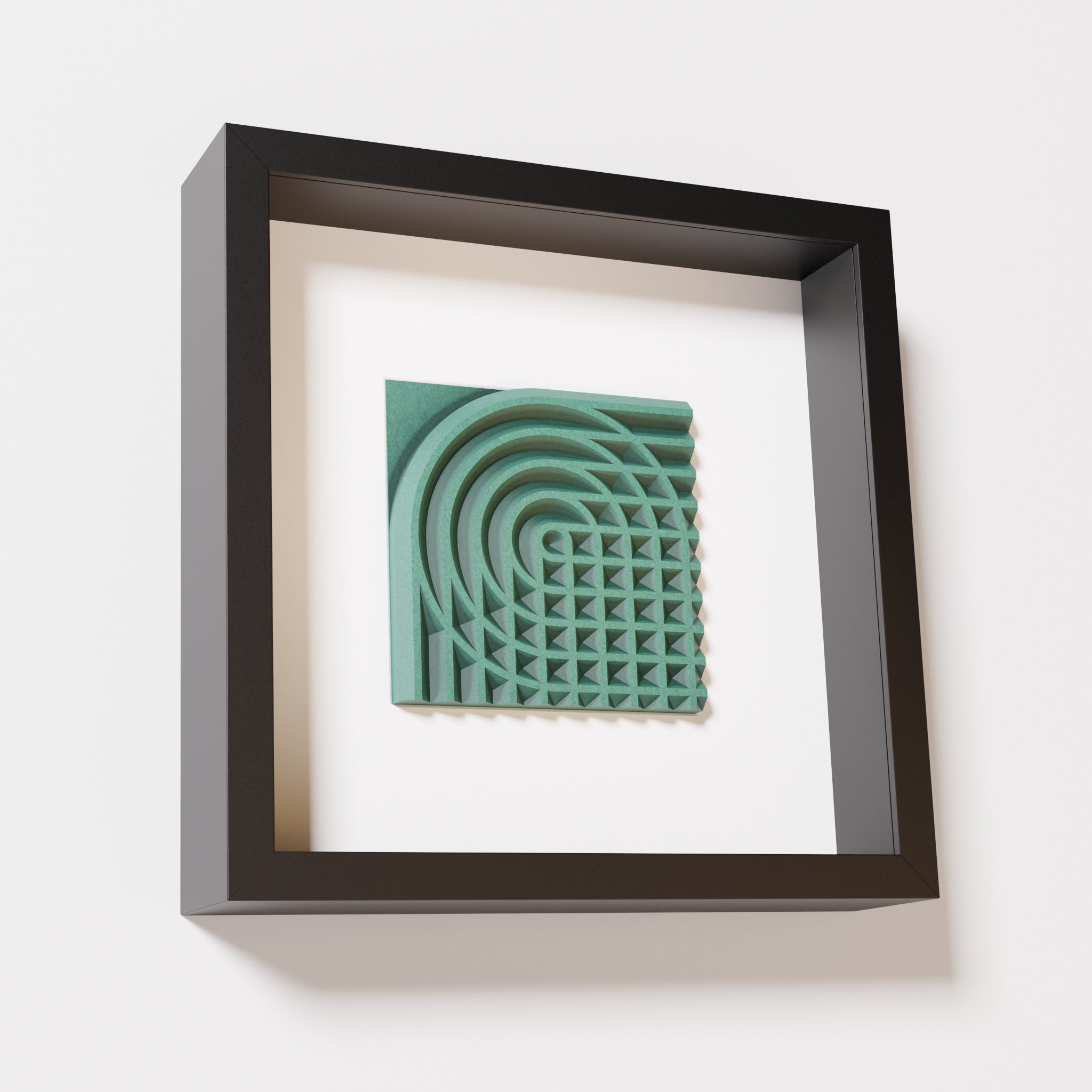 A close-up of a black shadowbox frame containing an old patina artwork featuring the elegant arcs and geometric grid of 'Rainbow II,' showcasing a textured green finish.