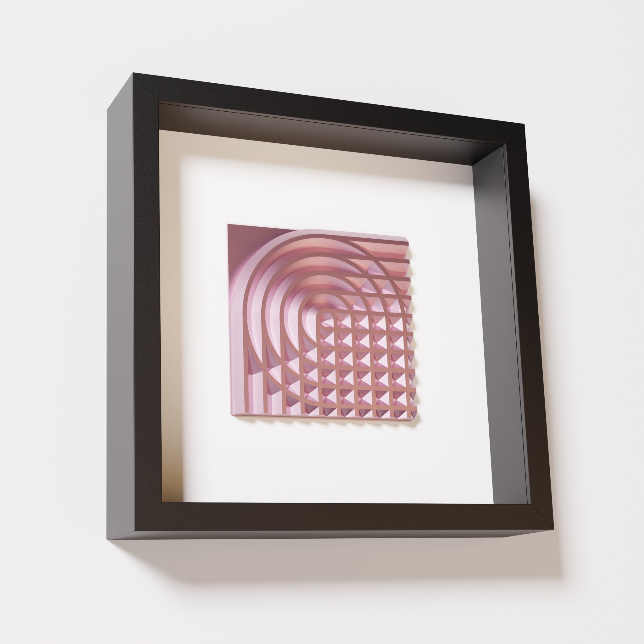 A close-up of a black shadowbox frame containing a metallic rose artwork featuring the elegant arcs and geometric grid of 'Rainbow II,' showcasing reflective pink highlights.