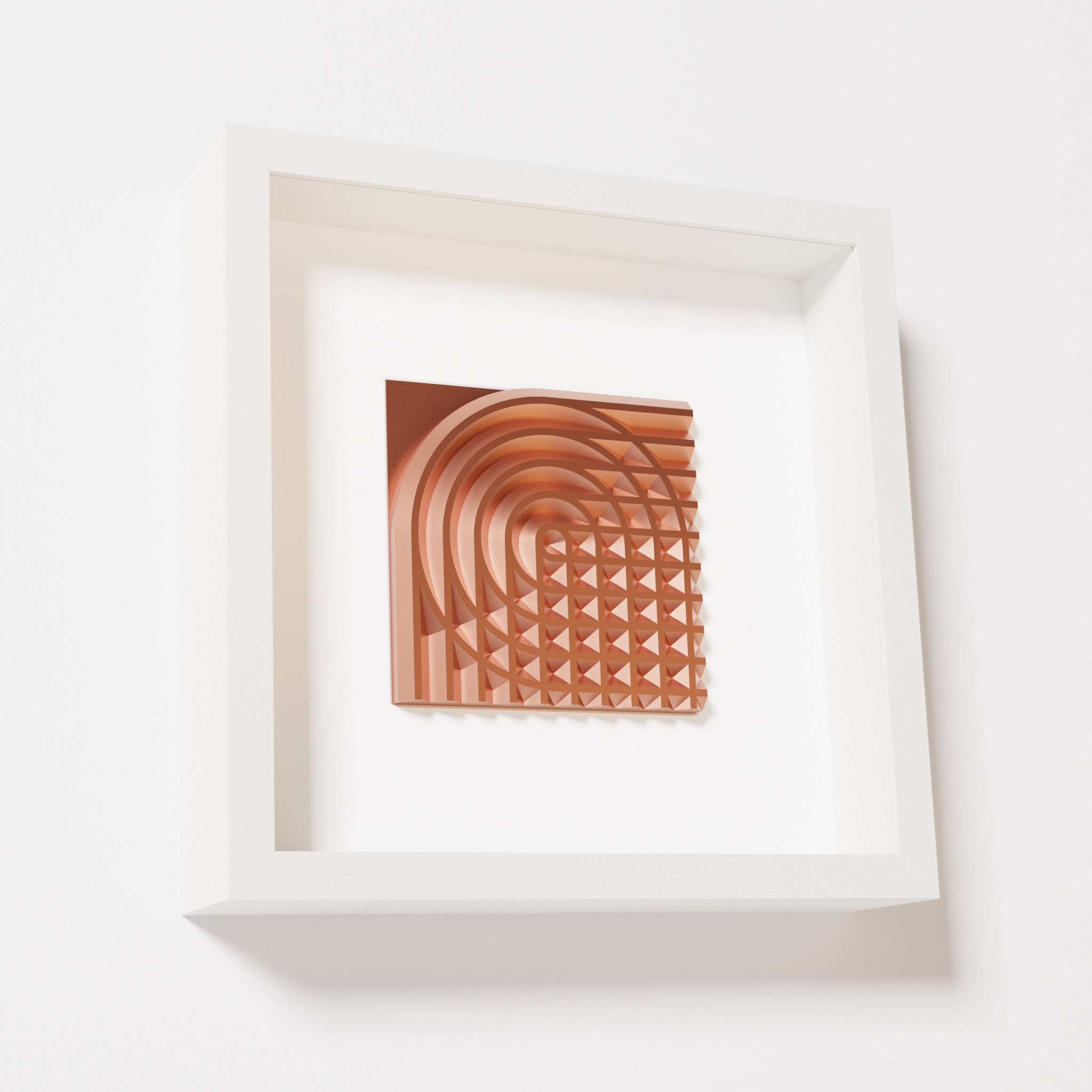 A close-up of a white shadowbox frame containing a chrome copper artwork featuring the elegant arcs and geometric grid of 'Rainbow II,' showcasing reflective copper highlights.