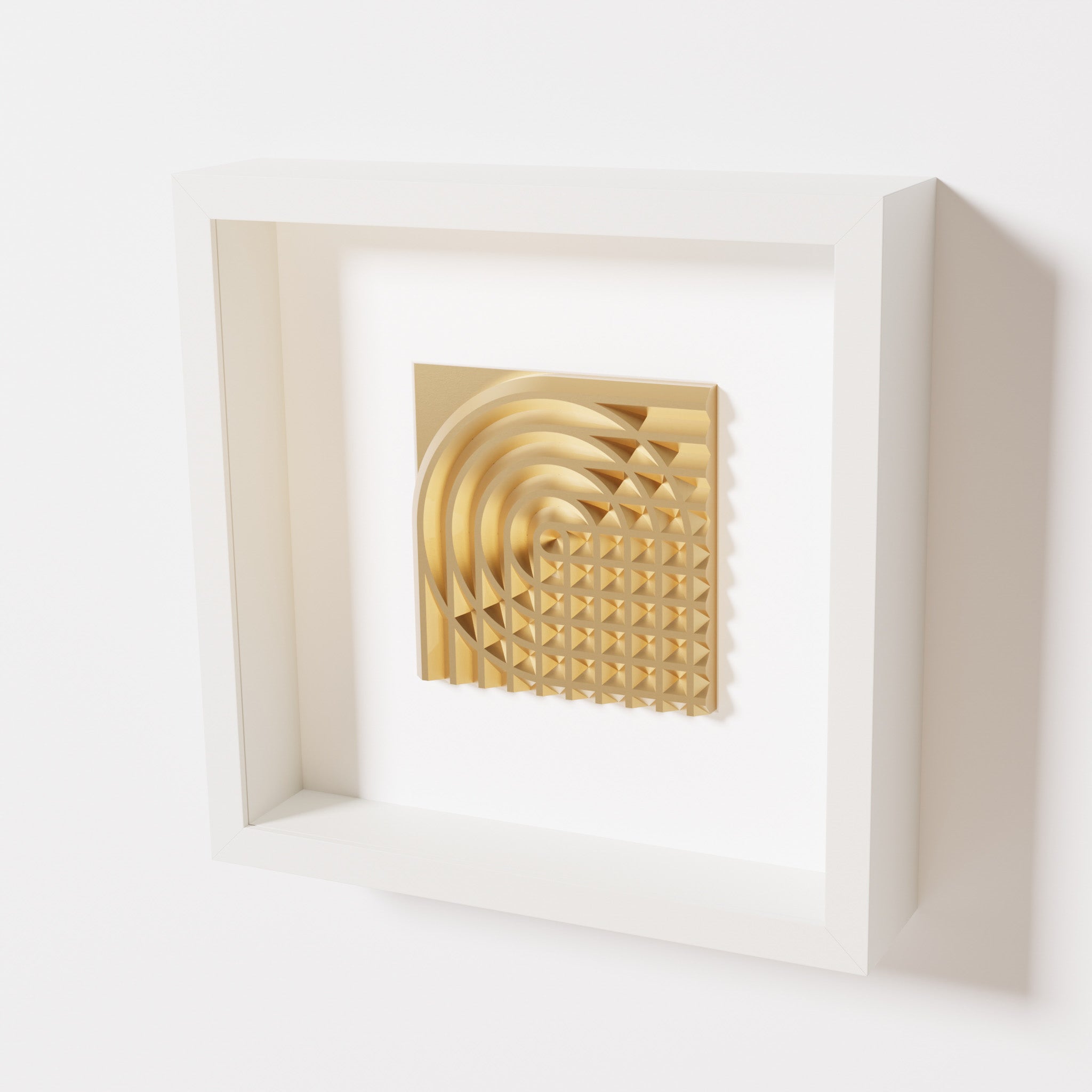 A close-up of a white shadowbox frame containing a chrome gold artwork featuring the elegant arcs and geometric grid of 'Rainbow II,' showcasing reflective golden highlights.