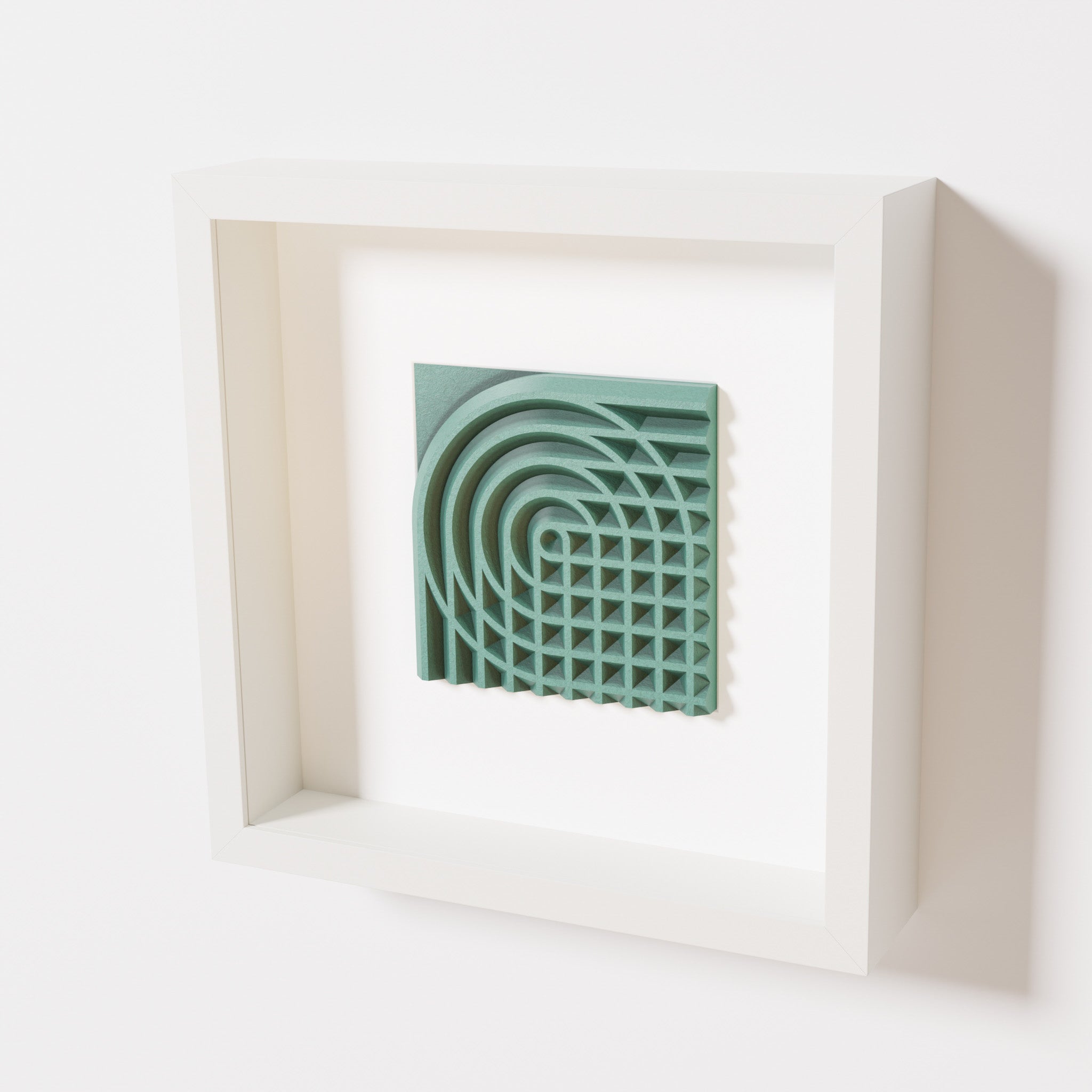 A close-up of a white shadowbox frame containing an old patina artwork featuring the elegant arcs and geometric grid of 'Rainbow II,' showcasing a textured green finish.