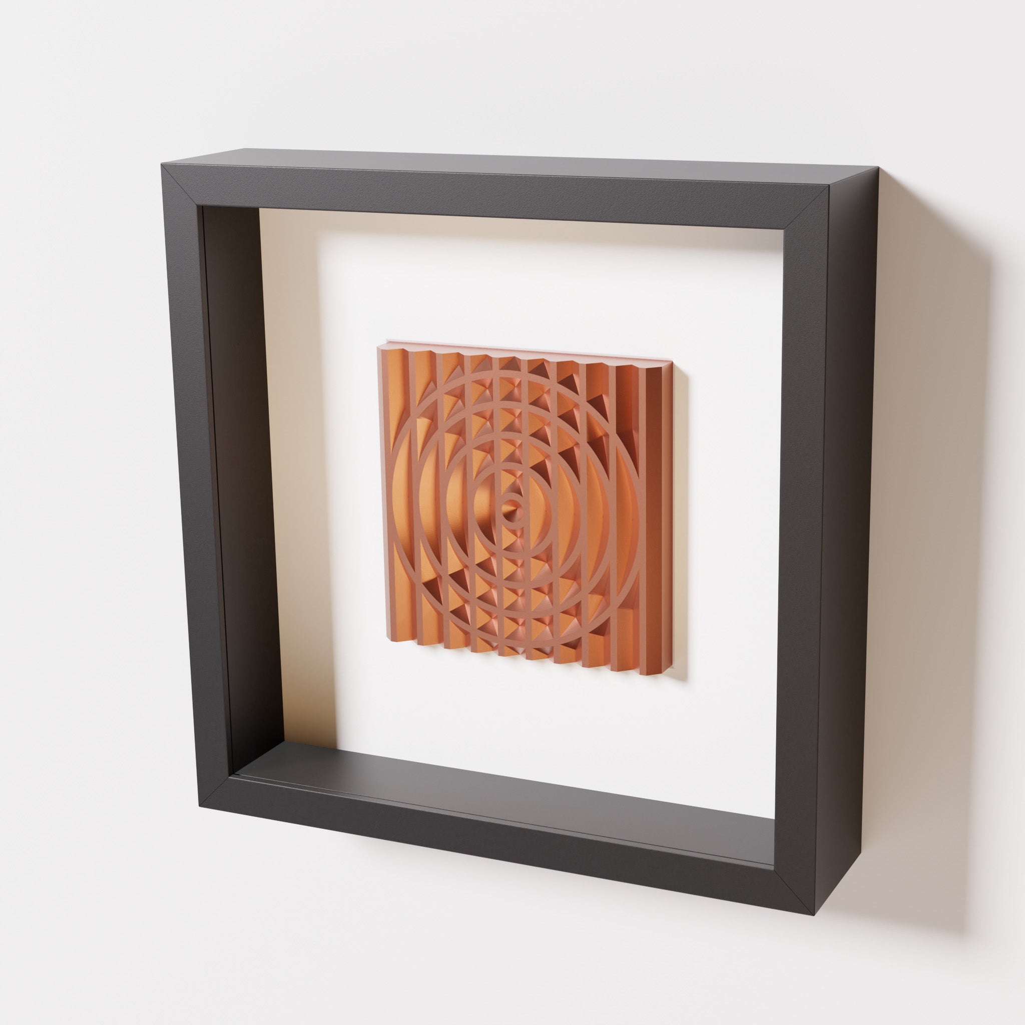 A close-up of a black shadowbox frame containing a chrome copper artwork featuring the elegant arcs and geometric grid of 'Rainbow III,' showcasing reflective copper highlights.