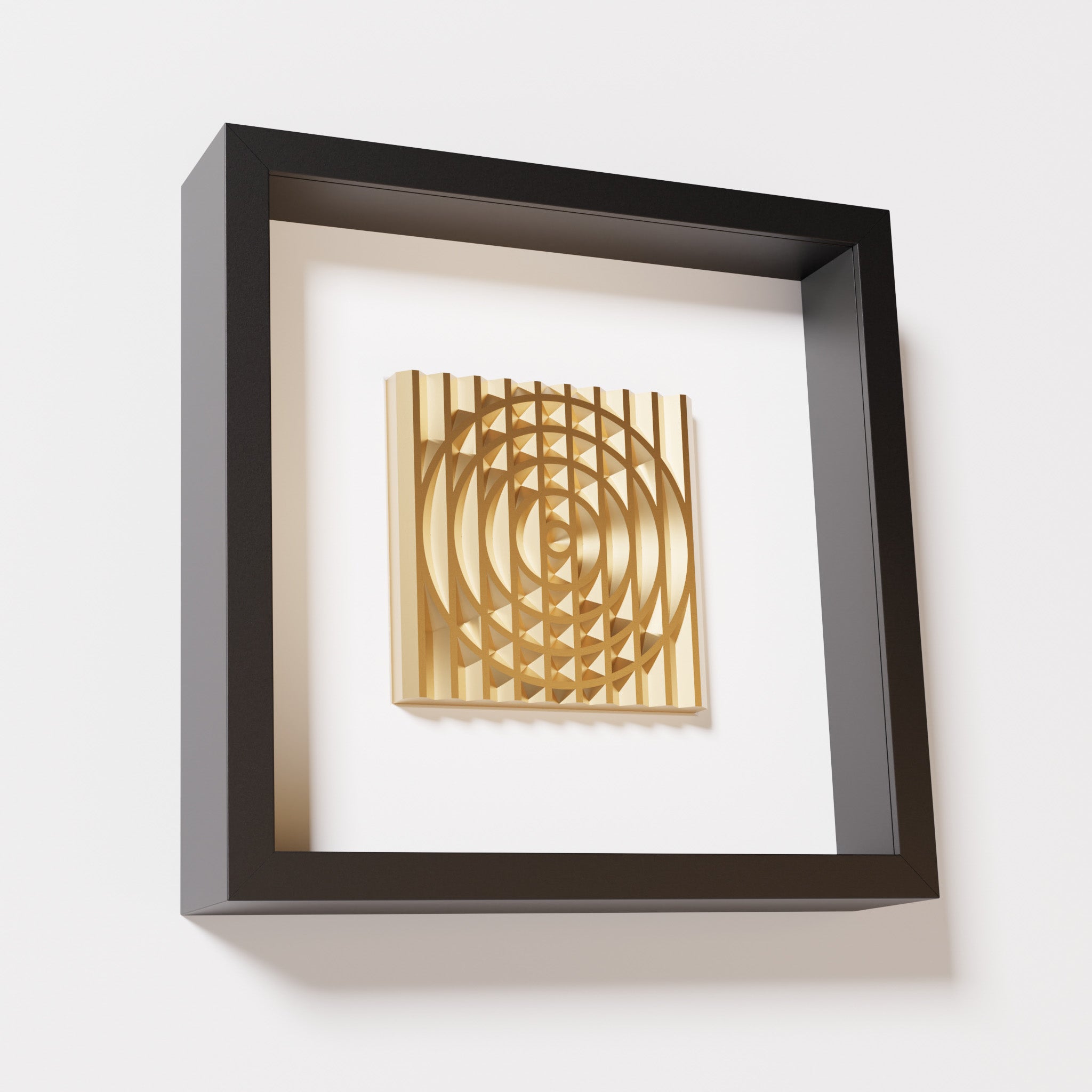 A close-up of a black shadowbox frame containing a chrome gold artwork featuring the elegant arcs and geometric grid of 'Rainbow III,' showcasing reflective golden highlights.