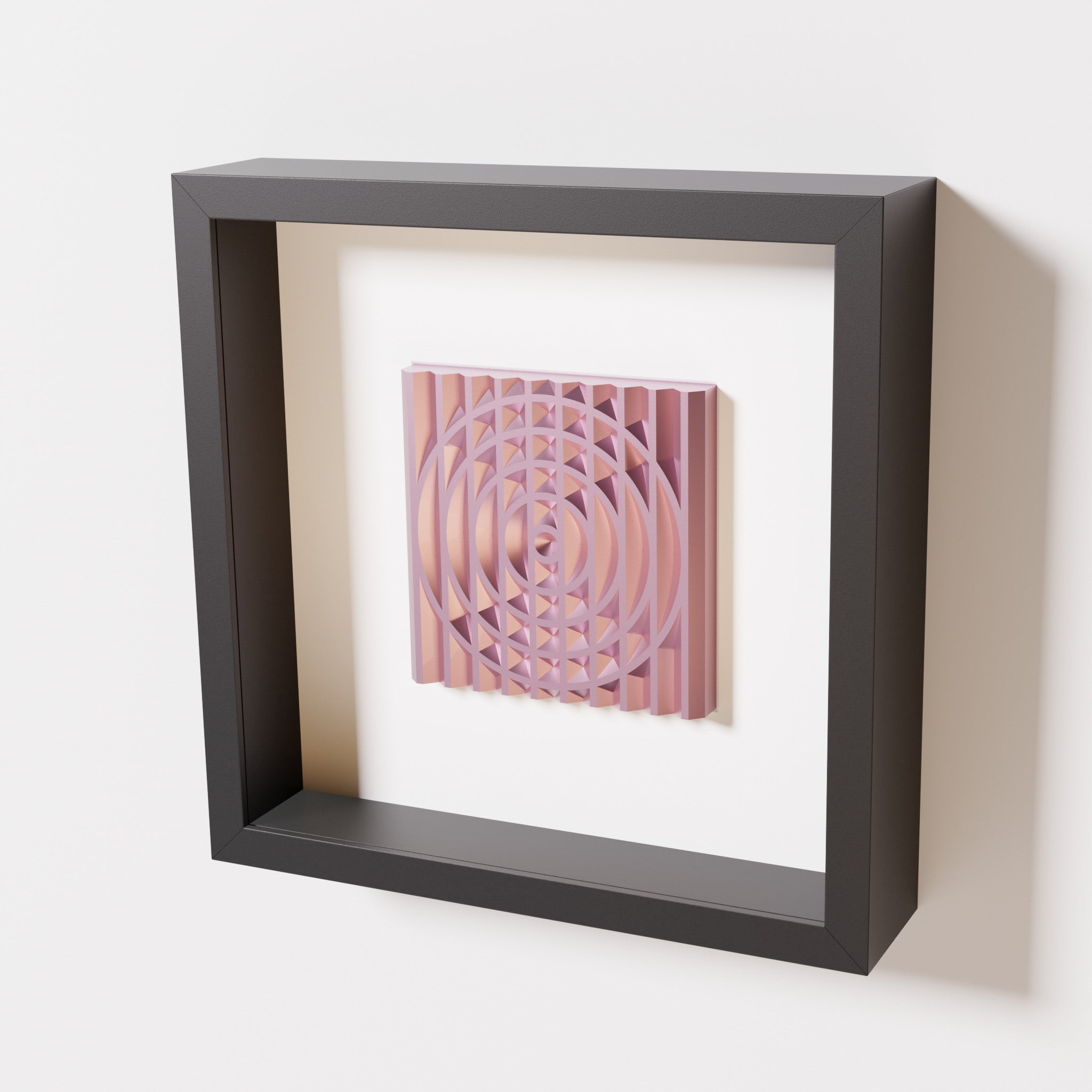 A close-up of a black shadowbox frame containing a metallic rose artwork featuring the elegant arcs and geometric grid of 'Rainbow III,' showcasing reflective pink highlights.