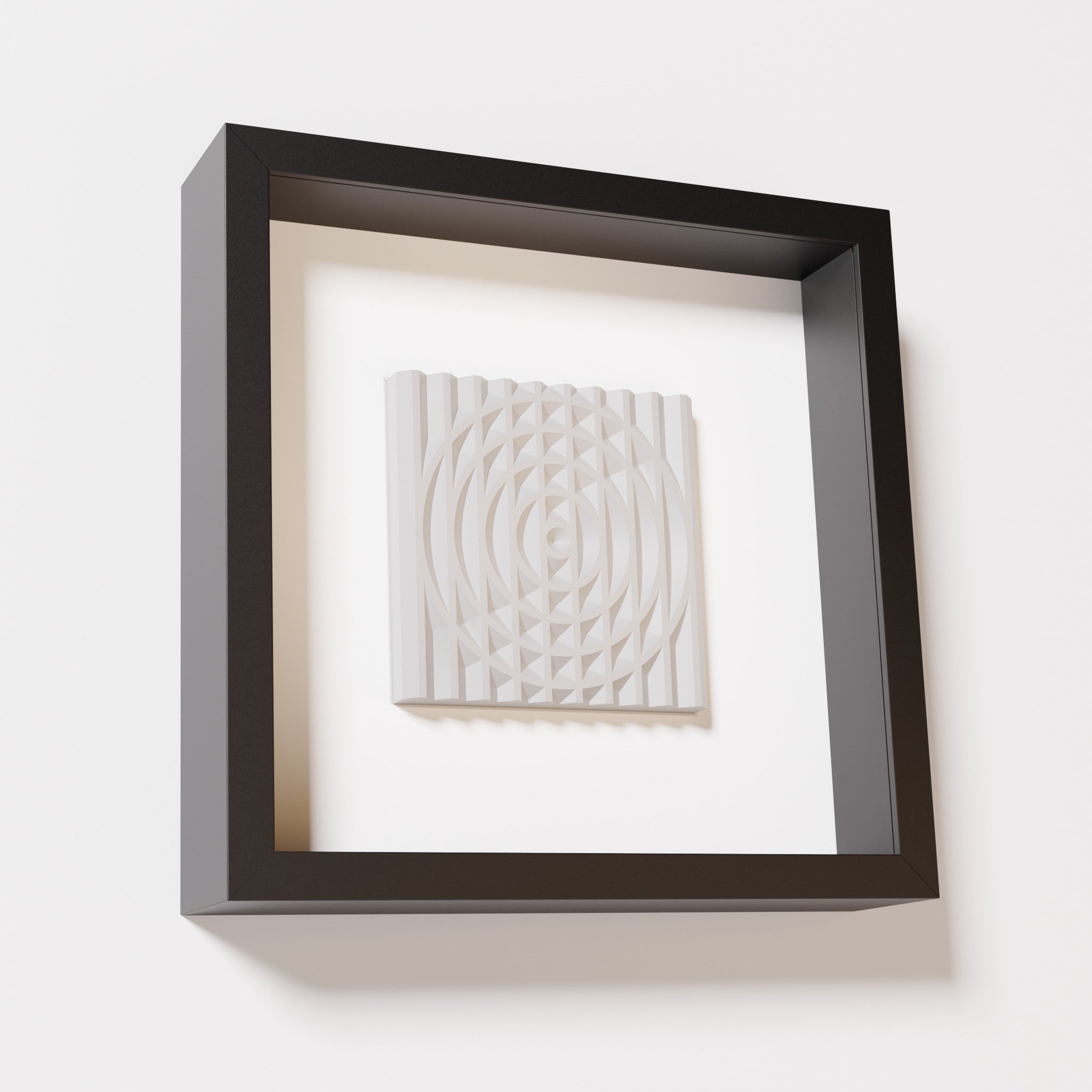 A close-up of a black shadowbox frame containing a marble white artwork featuring the elegant arcs and geometric grid of 'Rainbow III,' emphasizing its smooth texture and refined design.