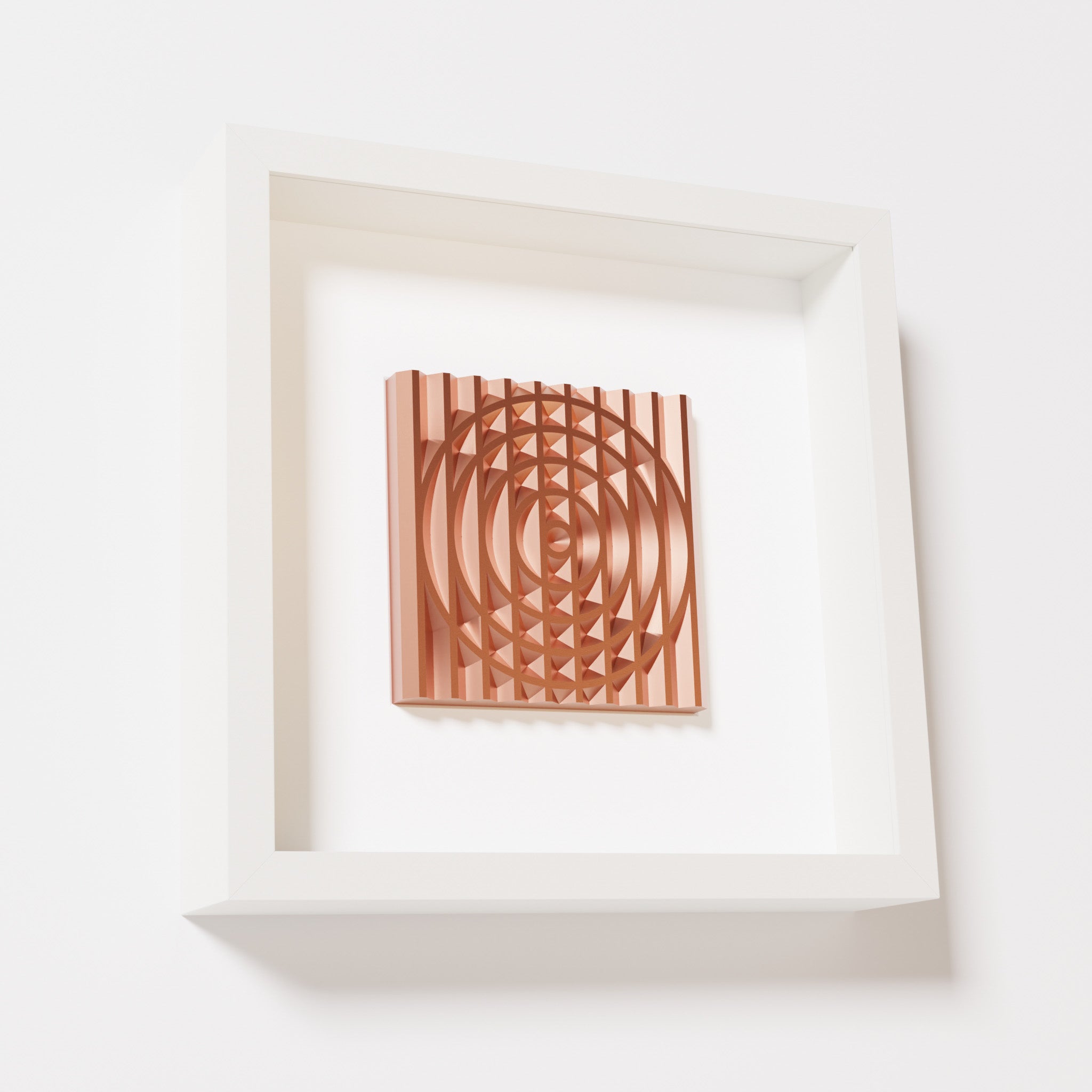 A close-up of a white shadowbox frame containing a chrome copper artwork featuring the elegant arcs and geometric grid of 'Rainbow III,' showcasing reflective copper highlights.