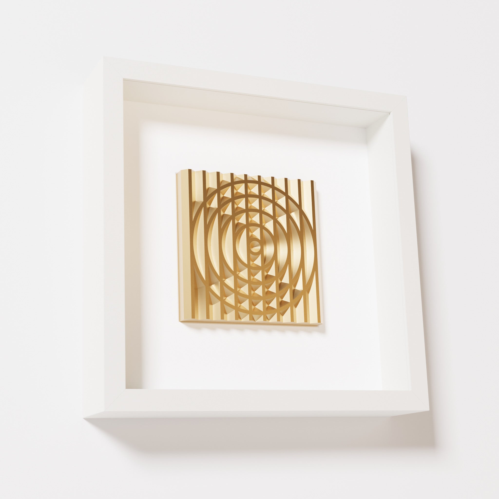 A close-up of a white shadowbox frame containing a chrome gold artwork featuring the elegant arcs and geometric grid of 'Rainbow III,' showcasing reflective golden highlights.