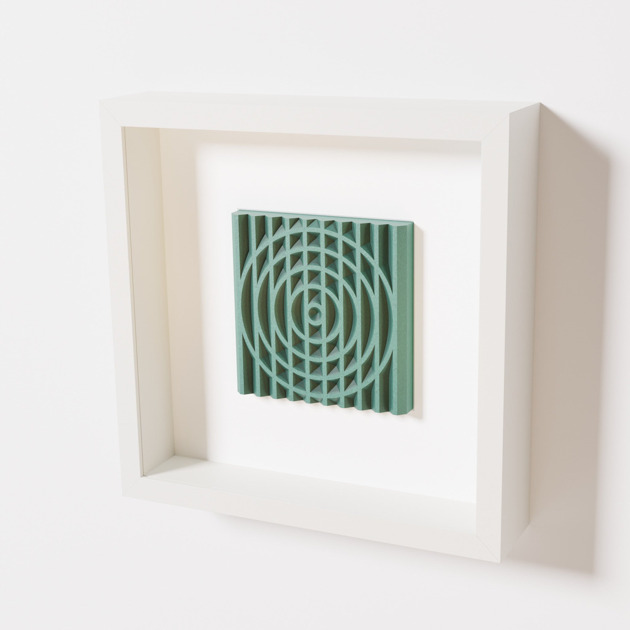 A close-up of a white shadowbox frame containing an old patina artwork featuring the elegant arcs and geometric grid of 'Rainbow III,' showcasing a textured green finish and intricate detail.