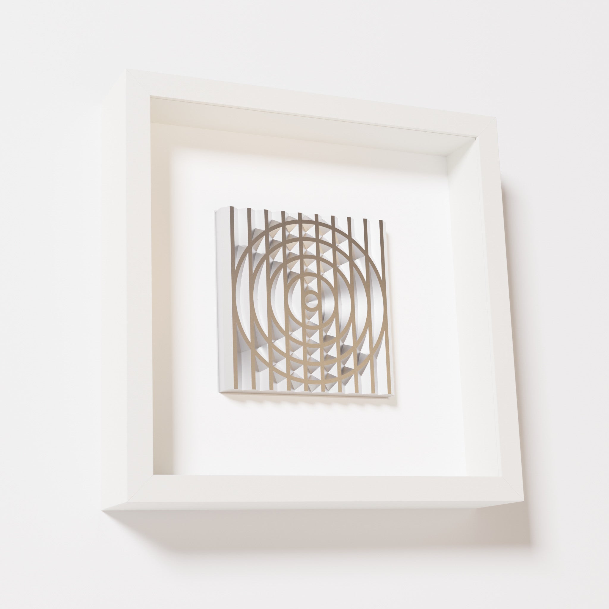 A close-up of a white shadowbox frame containing a chrome silver artwork featuring the elegant arcs and geometric grid of 'Rainbow III,' showcasing reflective silver highlights.