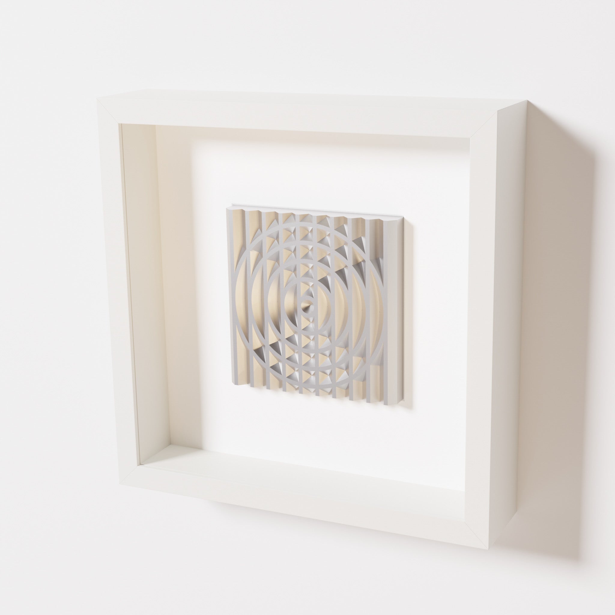 A close-up of a white shadowbox frame containing a chrome silver artwork featuring the elegant arcs and geometric grid of 'Rainbow III,' showcasing reflective silver highlights.