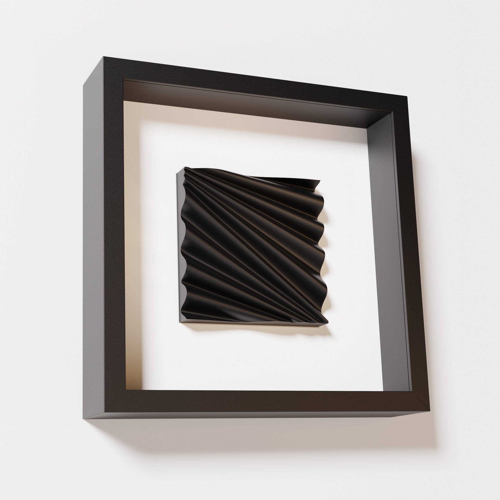 A close-up of a black shadowbox frame containing a matte black artwork featuring the rhythmic crests and troughs of 'Wave,' emphasizing its intricate texture and dynamic design.