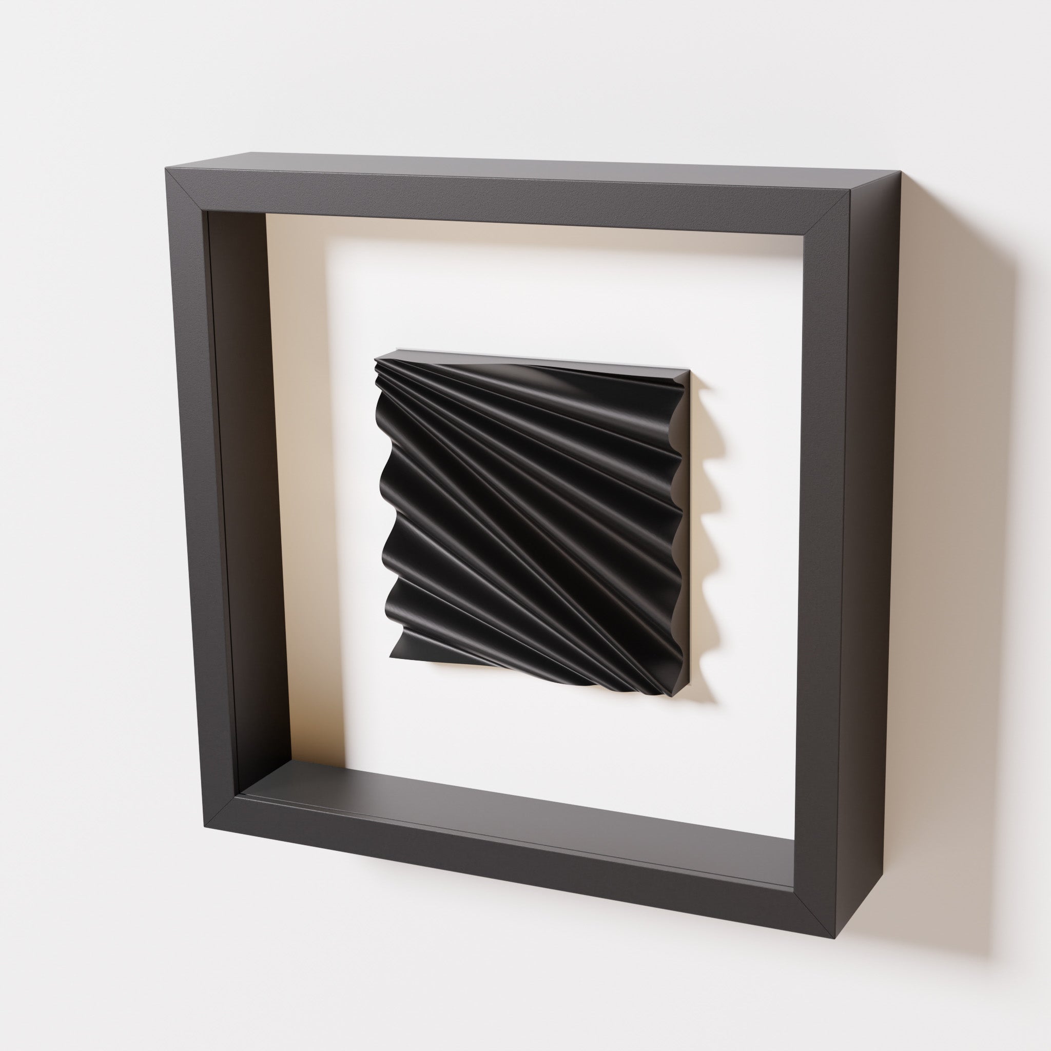 A close-up of a black shadowbox frame containing a matte black artwork featuring the rhythmic crests and troughs of 'Wave,' emphasizing its intricate texture and dynamic design.