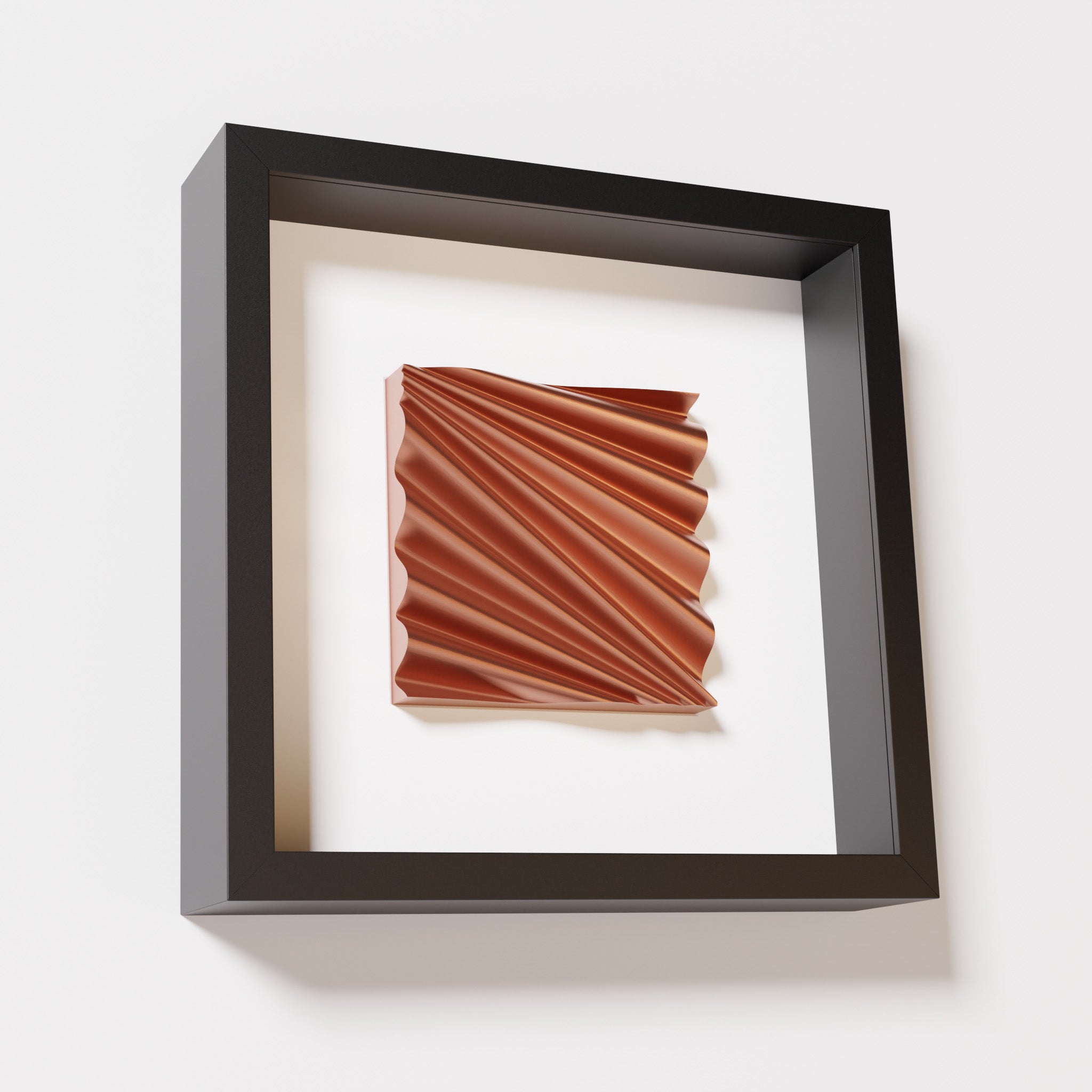 A close-up of a black shadowbox frame containing a chrome copper artwork featuring the rhythmic crests and troughs of 'Wave,' showcasing reflective copper highlights.