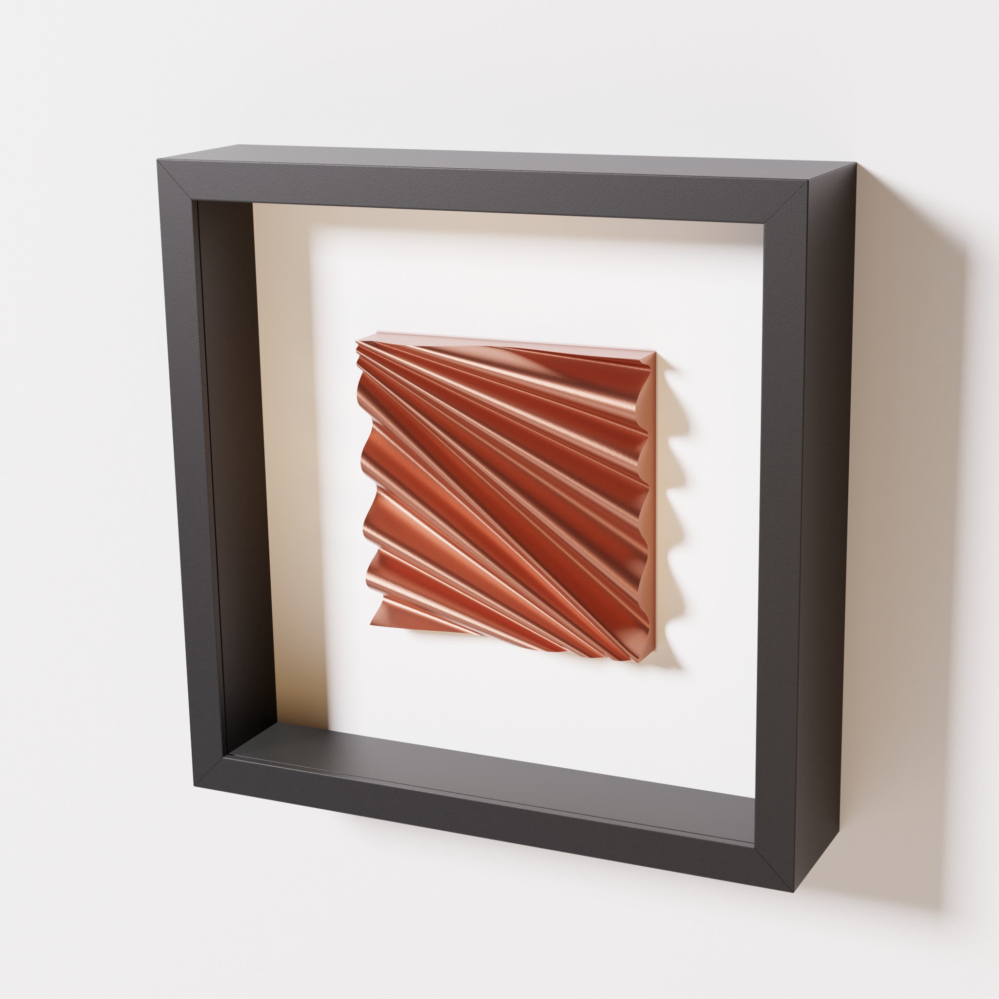 A close-up of a black shadowbox frame containing a chrome copper artwork featuring the rhythmic crests and troughs of 'Wave,' showcasing reflective copper highlights.