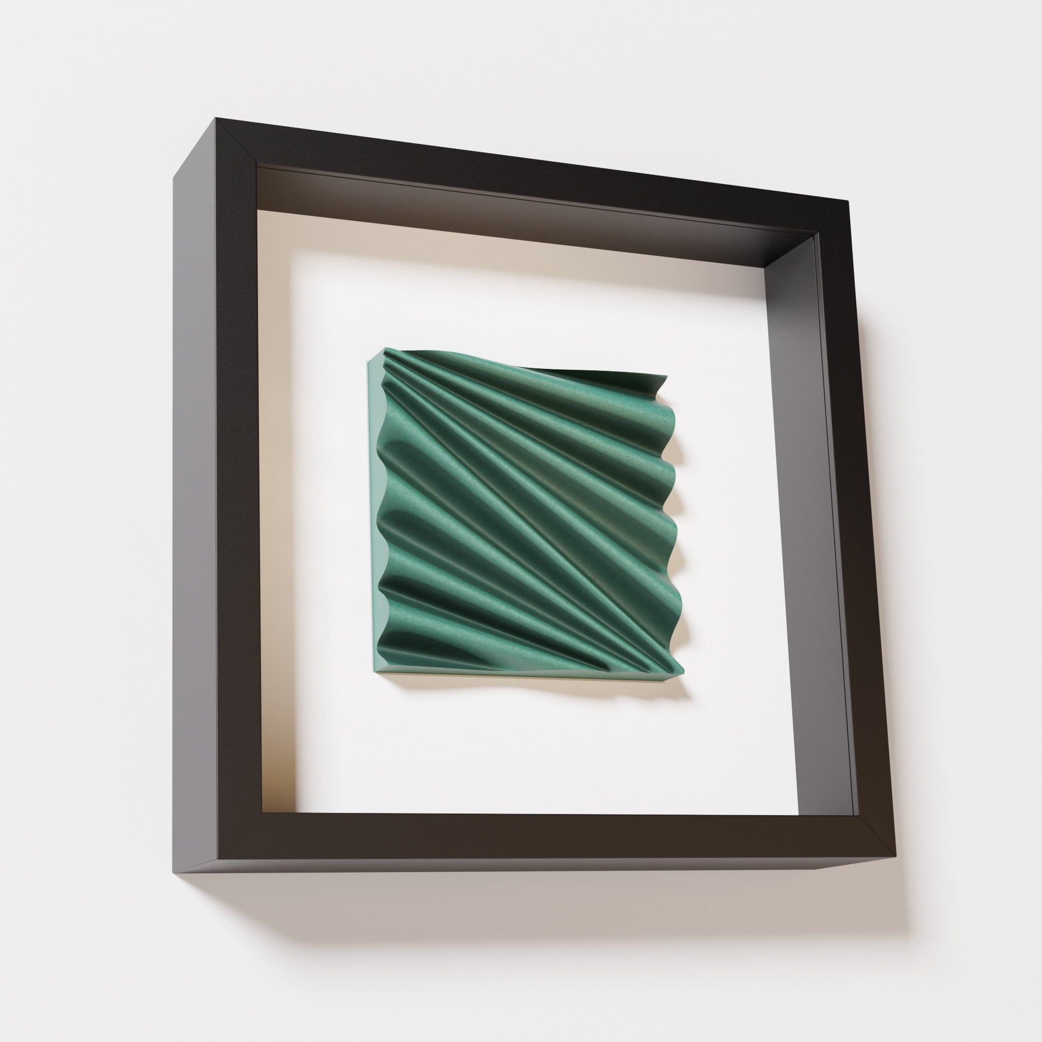 A close-up of a black shadowbox frame containing an old patina artwork featuring the rhythmic crests and troughs of 'Wave,' showcasing a textured green finish and intricate detail.