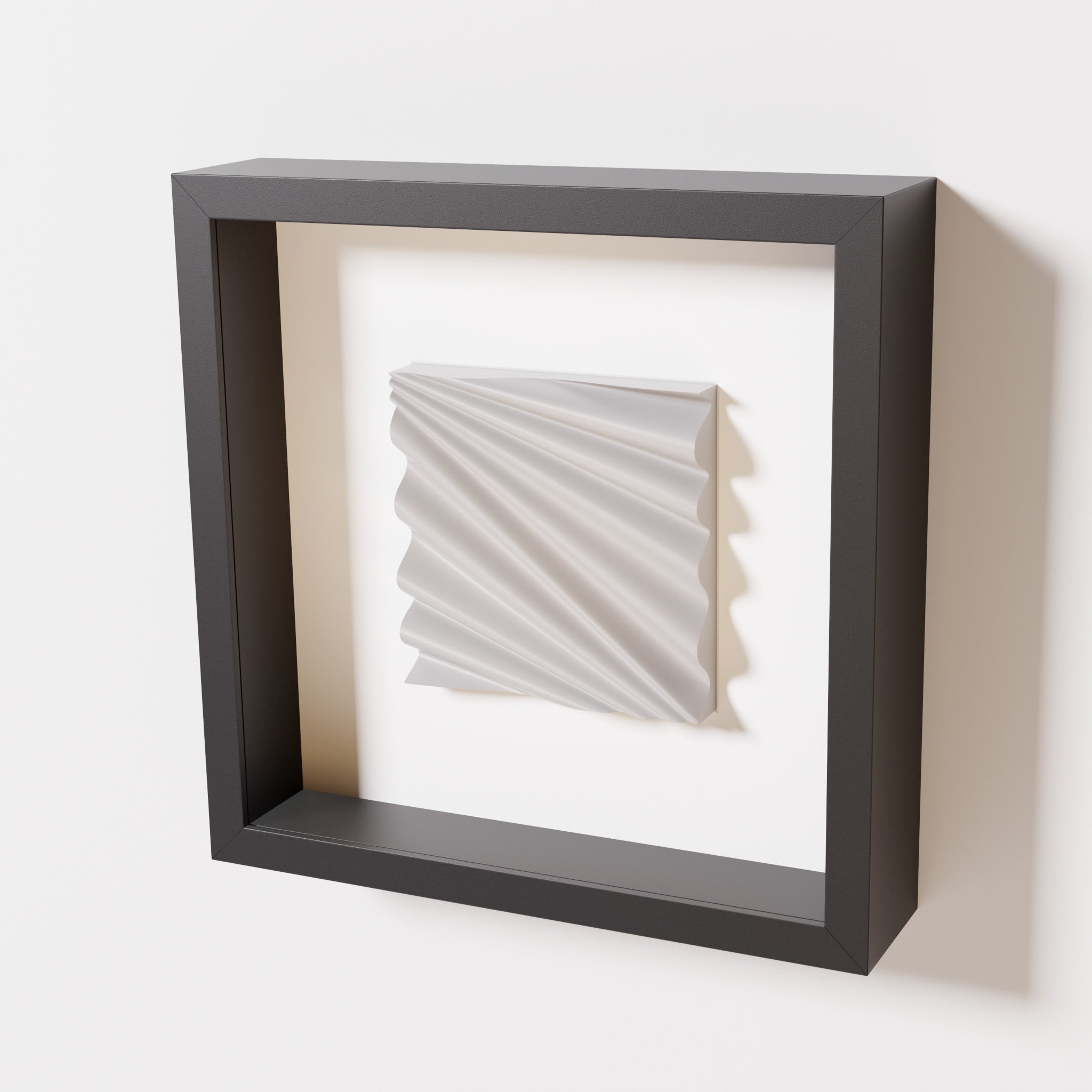 A close-up of a black shadowbox frame containing a marble white artwork featuring the rhythmic crests and troughs of 'Wave,' emphasizing its smooth texture and dynamic design.