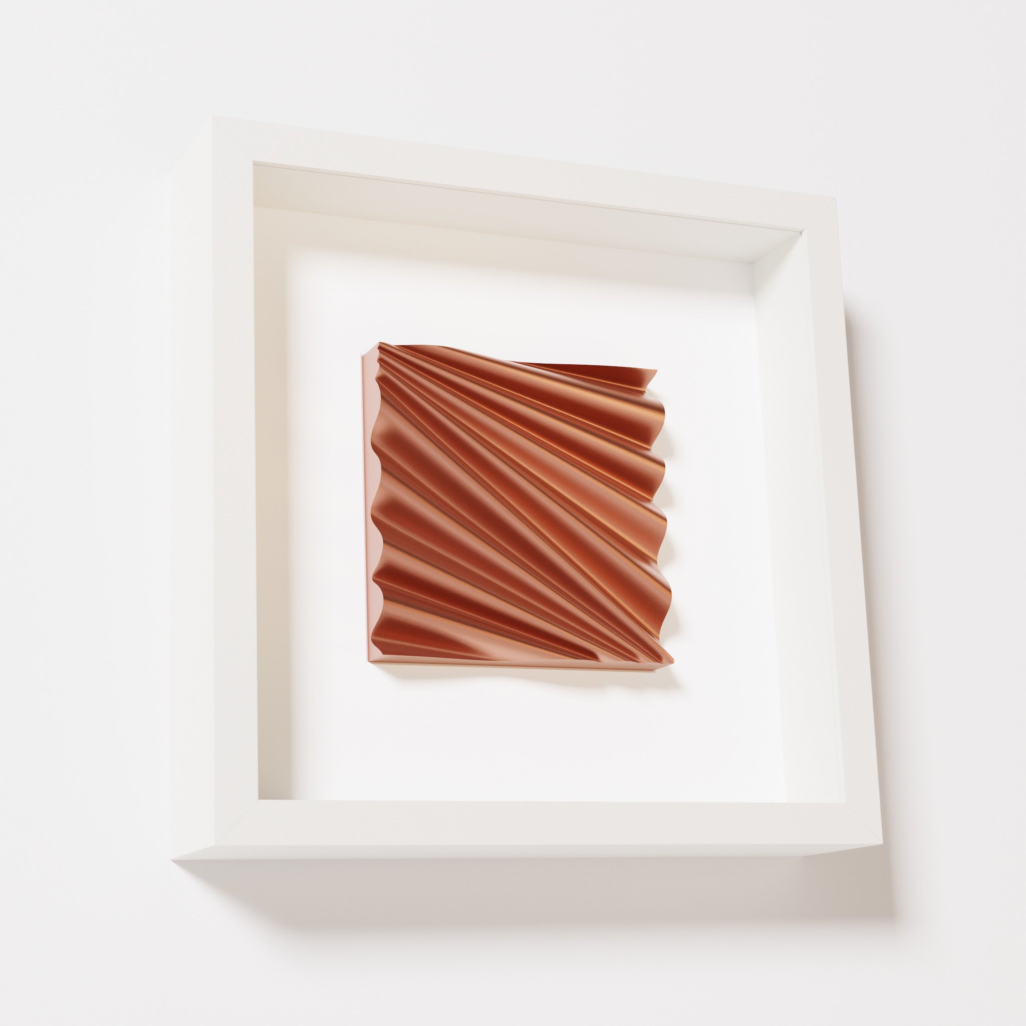 A close-up of a white shadowbox frame containing a chrome copper artwork featuring the rhythmic crests and troughs of 'Wave,' showcasing reflective copper highlights.