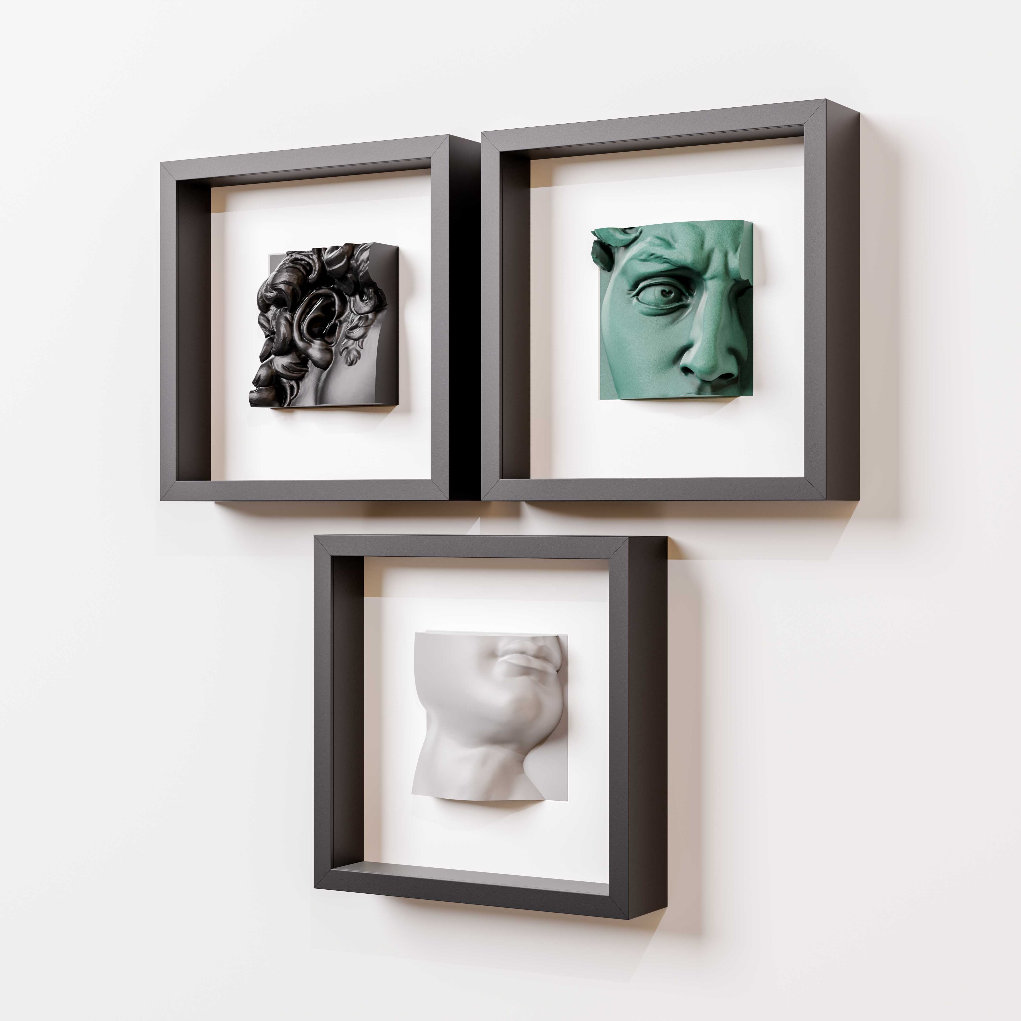 A minimalist arrangement of three black shadowbox frames, each showcasing a unique 3D sculpture: a black intricate Baroque-inspired design, a green classical eye detail, and a white modern profile of a face. Mounted on a clean white wall, this art display highlights a blend of textures, colors, and artistic styles, perfect for contemporary interior decor.